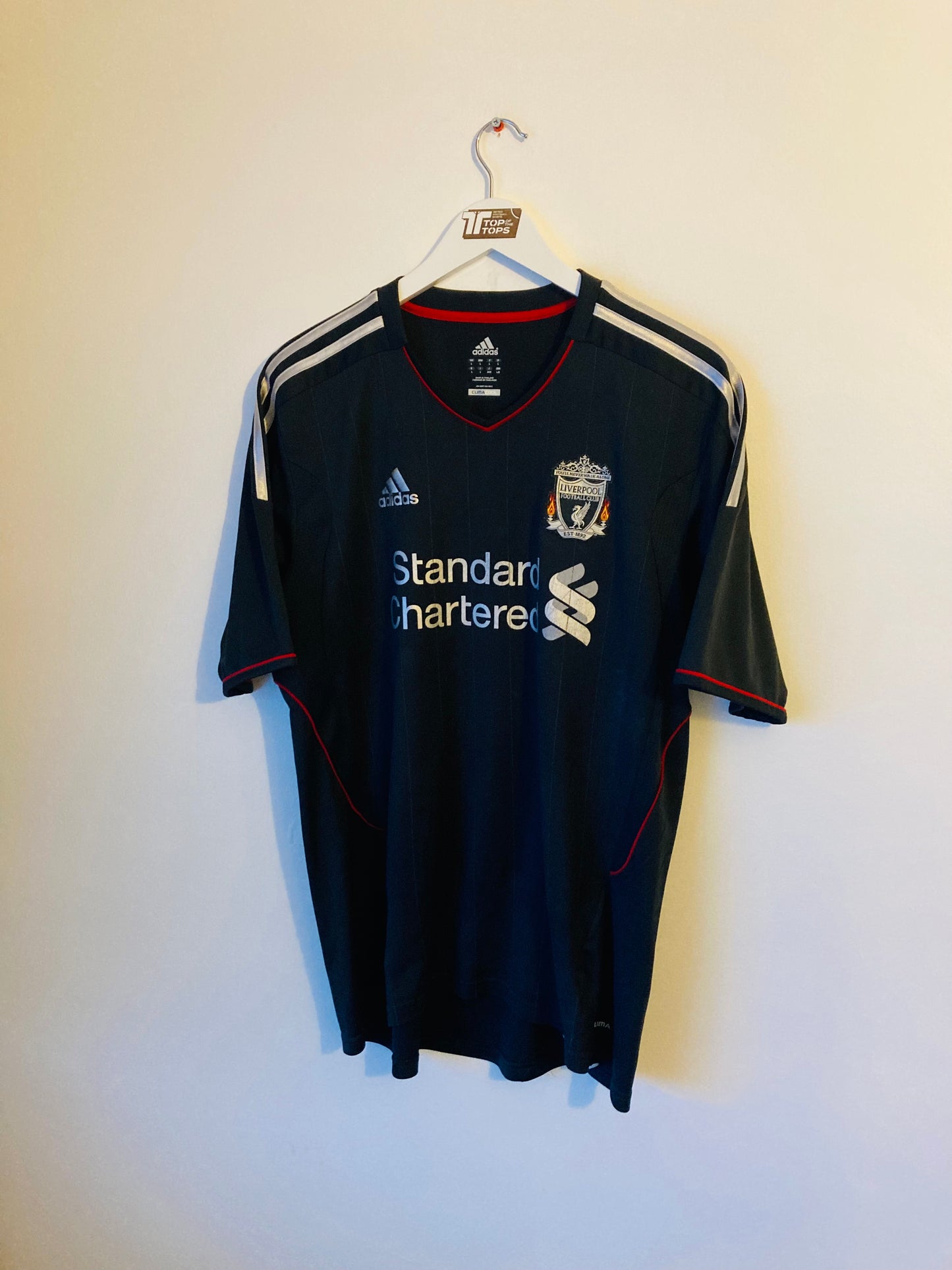 Liverpool away football shirt
2011/12 Suarez Large
