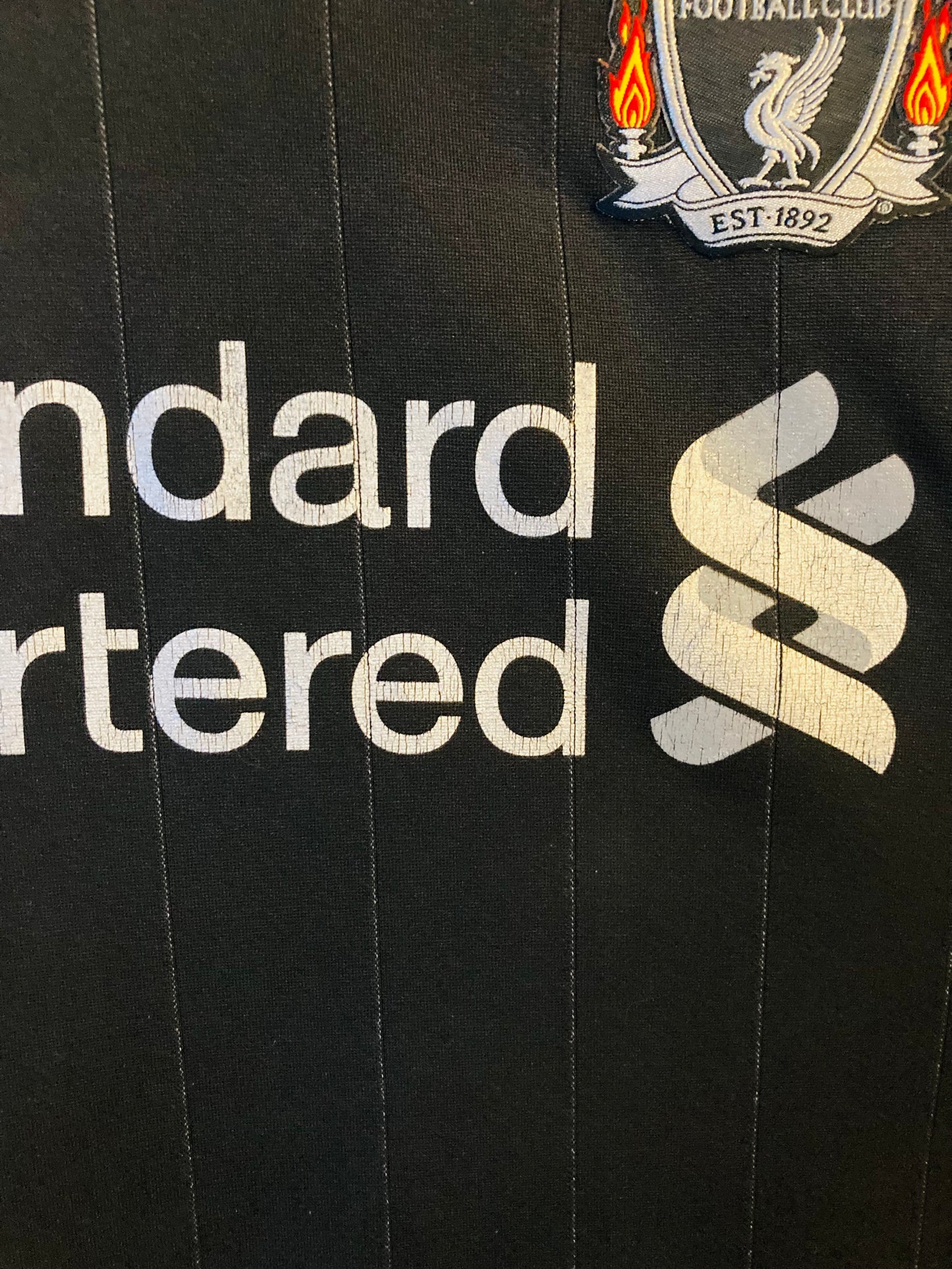 Liverpool away football shirt
2011/12 Suarez Large
