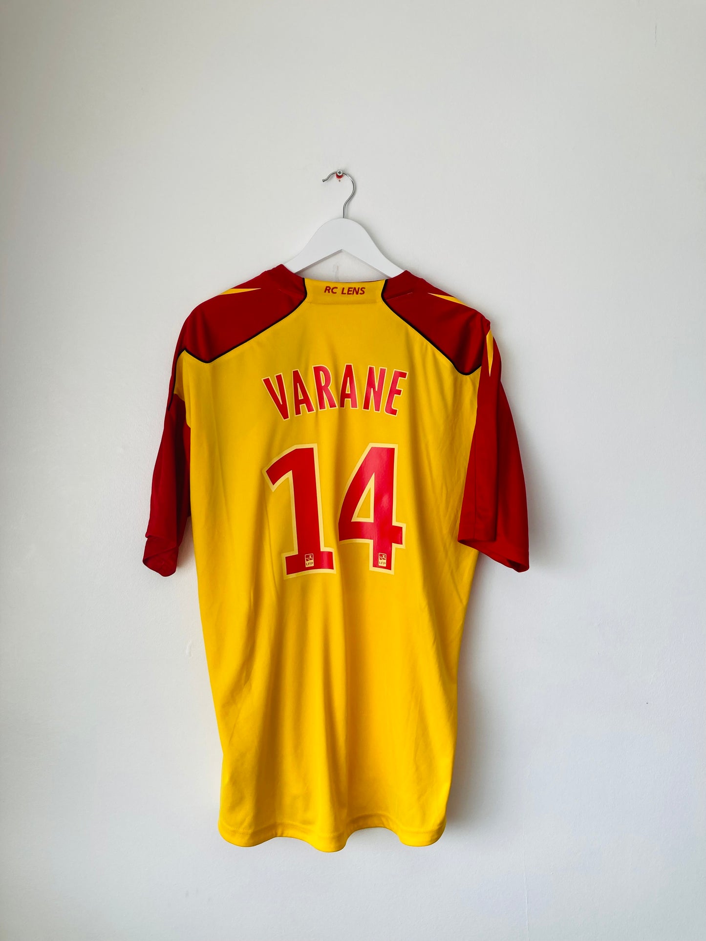 Lens home football shirt
2010/11 Varane XL