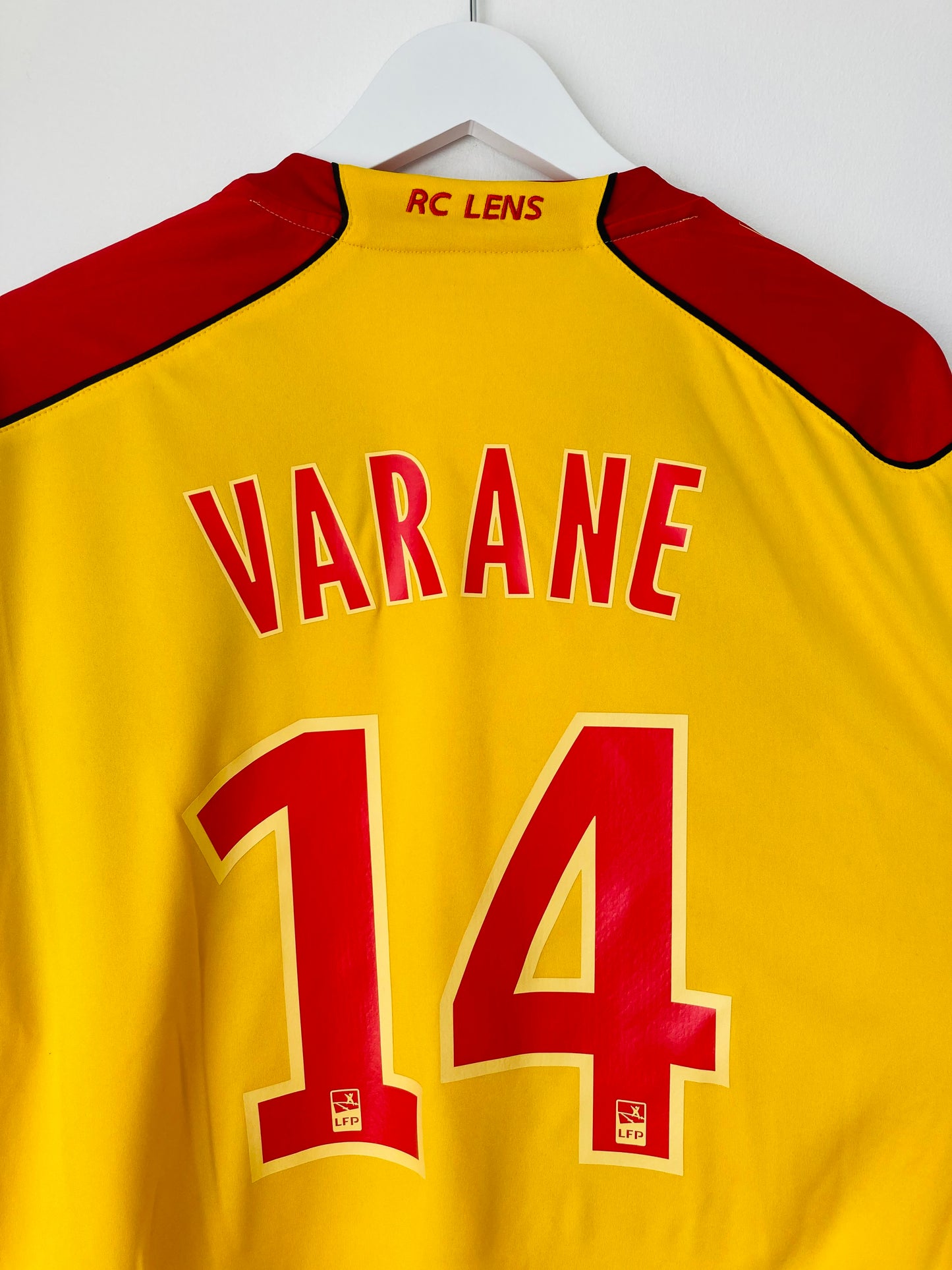 Lens home football shirt
2010/11 Varane XL